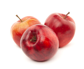 Several red apples lie on a white background