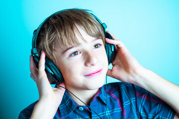 Child listening to music with headphones Hobby and lifestyles