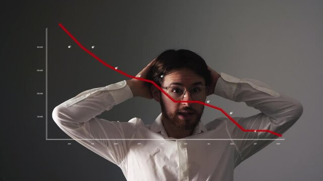 Young businessman looks scared at graph with red falling curve. Financial down crisis graph, falling trend. Failed Business concept.