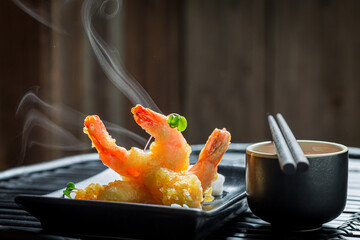 Shrimp in tempura served with red sauce. Chinese cuisine.