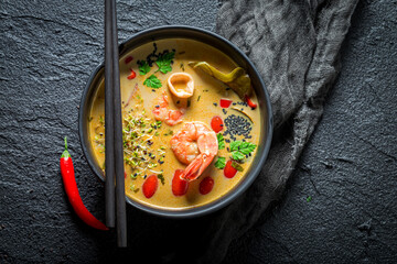 Tasty Tom Yum soup with shrimps. Thai cuisine.