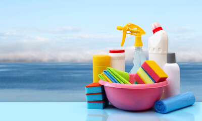 Cleaning products on a fresh blue background of the sea.