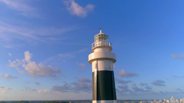 Aerial image surrounding the top of Olinda lighthouse with blue sky with clouds in the background