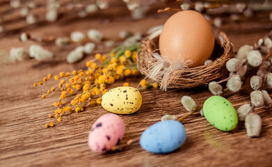Christian holiday. A painted quail egg lies in the nest. 