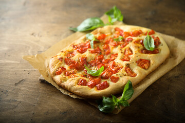 Delicious homemade focaccia with tomatoes and garlic