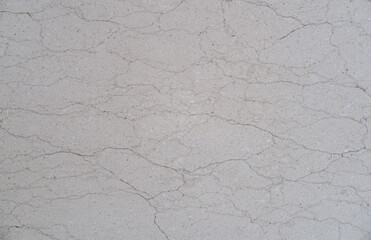 Close up of cracked concrete floor texture.