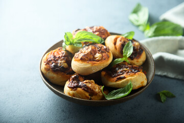 Homemade cheese swirls with pesto sauce