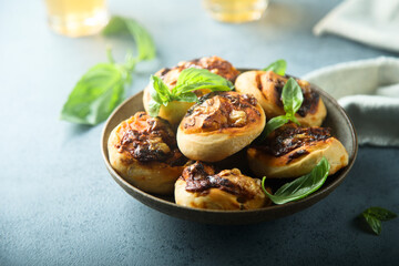 Homemade cheese swirls with pesto sauce