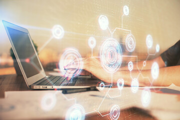 Multi exposure of woman hands working on computer and data theme hologram drawing. Tech concept.