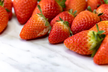 still life with strawberries on a white patterned background