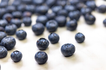 still life with blueberries on a white patterned background