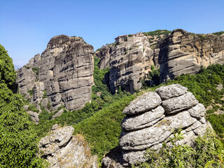 Meteora Greece. Picturesque rocks against blue sky. Travel, vacation. Beauty in nature, mountain landscape.