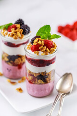 Berry pudding with fresh berries, granola and greek yogurt.
