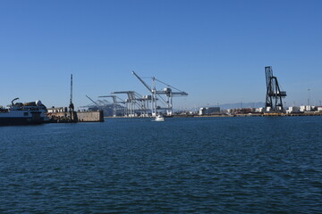Super Post Panamax cranes at the Port of Oakland. The giant cranes at the apex are roughly the height of a 24 story building and can weigh 1600 to 2000 tons each.