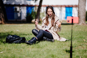 woman tutoring online and explain something using smartphone. distance study concept. Female...