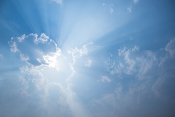 blue sky , White clouds floating on sky and sun shines through the clouds. for backgrounds concept.
