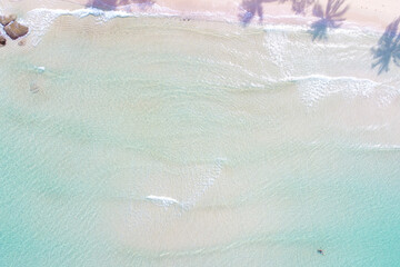 Aerial view azure sea water white sand beach with coconut shadow