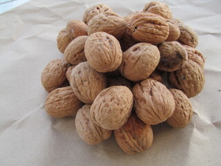 Natural walnuts in a wooden shell. Photographed close-up.