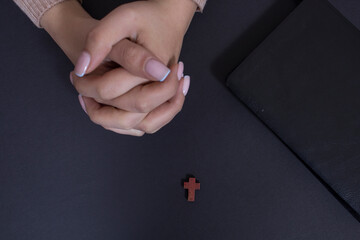 girl praying on the cross