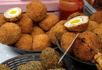 Scotch eggs on big bowl. Street food in the UK .London street food market serving scotch eggs.