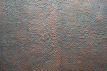 Detail of perforated copper metal sheet. Copper checker board with black holes. Rusty old perforated metal plate material surface texture background. Rust steel brass plate backdrop.