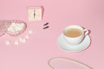 Romantic feminine fashion layout with alarm clock, false eyelashes, sugar cubes, pearl necklace and...