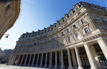 Traditional French house with typical balconies and windows. Paris .