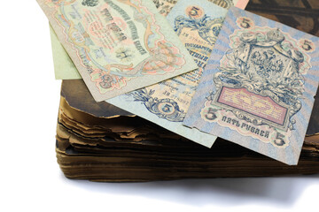 vintage antique paper money on old antique book close up