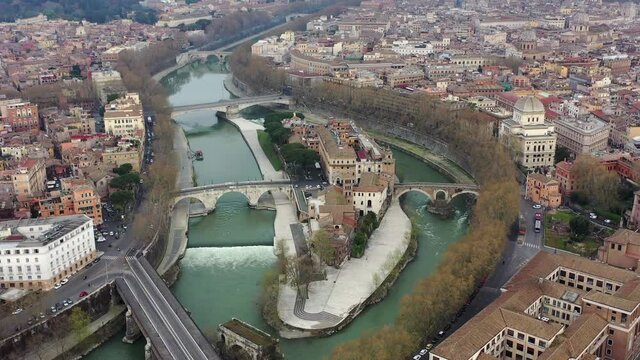 Tiberina Island on the Tiber River, Rome Italy. Isola Tiberina, Roma, Italia. Rome seen from above. Aerial shot of the bridges over the Tiber river