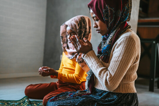 Muslim Family Praying Together. Religious Activity Concept