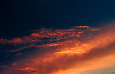 Beautiful summer sunset sky, dark blue and orange colors