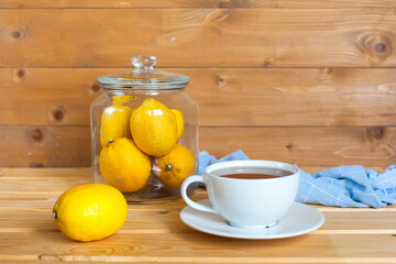 A cup of fresh tea with lemons. An invigorating drink