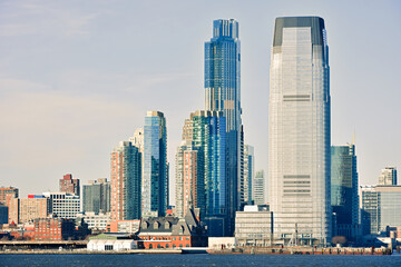 Buildings architecture of Manhattan seen from ferry boat cruise on Hudson River, New York City, USA.