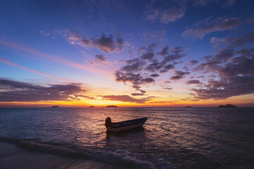 Boat on beach in sunset at Koh Chang Trad Thailand