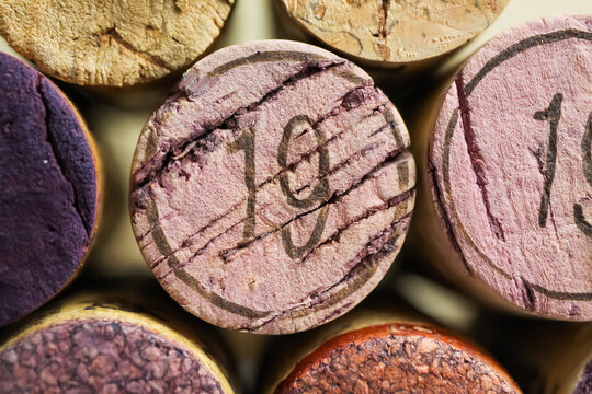 Makro closeup of pile isolated vintage red wine corks with number 19 (focus on center)