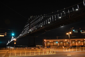 the San Francisco Oakland Bay Bridge illuminated at night