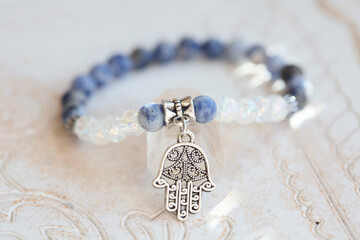 Mineral stone beads yoga bracelet on neutral natural background