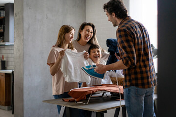 Happy Family Doing Household Chores and Housekeeping