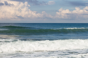Fototapeta na wymiar Seascape. Blue Sea, White Waves, Blue Sky.