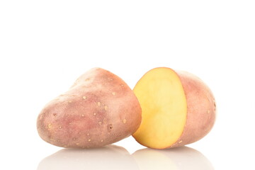 Two halves of unpeeled raw potatoes, close-up, isolated on white.