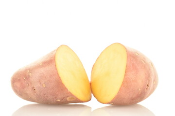 Two halves of unpeeled raw potatoes, close-up, isolated on white.