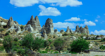 Fantastic View to the Göreme with rock houses in front of the spectacularly coloured valleys nearby, Cappadocia, Turkey