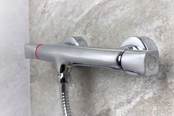 Bath Shower Mixer. Detail of shower mixer faucet, chrome-plated metal faucet for the bathroom.