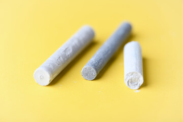 Soft pastels on yellow background. Close up.	