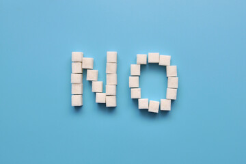 The word "No" is made of sugar cubes. Avoiding sugar and sweets