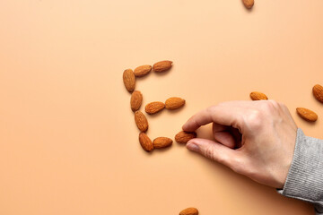 The letter E is made from almonds. A large amount of vitamin E in nuts