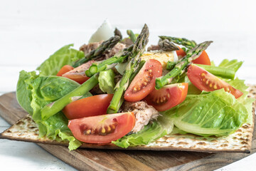 Tuna Salad on matzah bread. Food ideas for Jewish holiday Pesach.