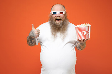 Fat chubby overweight tattooed man in 3d glasses watch movie film hold bucket of popcorn show thumb...