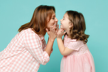Happy woman in pink clothes have fun with child baby girl 5-6 years old. Mommy little kid daughter...