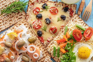 Matzah Sandwiches on blue wooden background. Food for Jewish holiday Pesach.